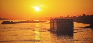 Sunset cruise on the Nile River in Egypt with warm evening light over the water