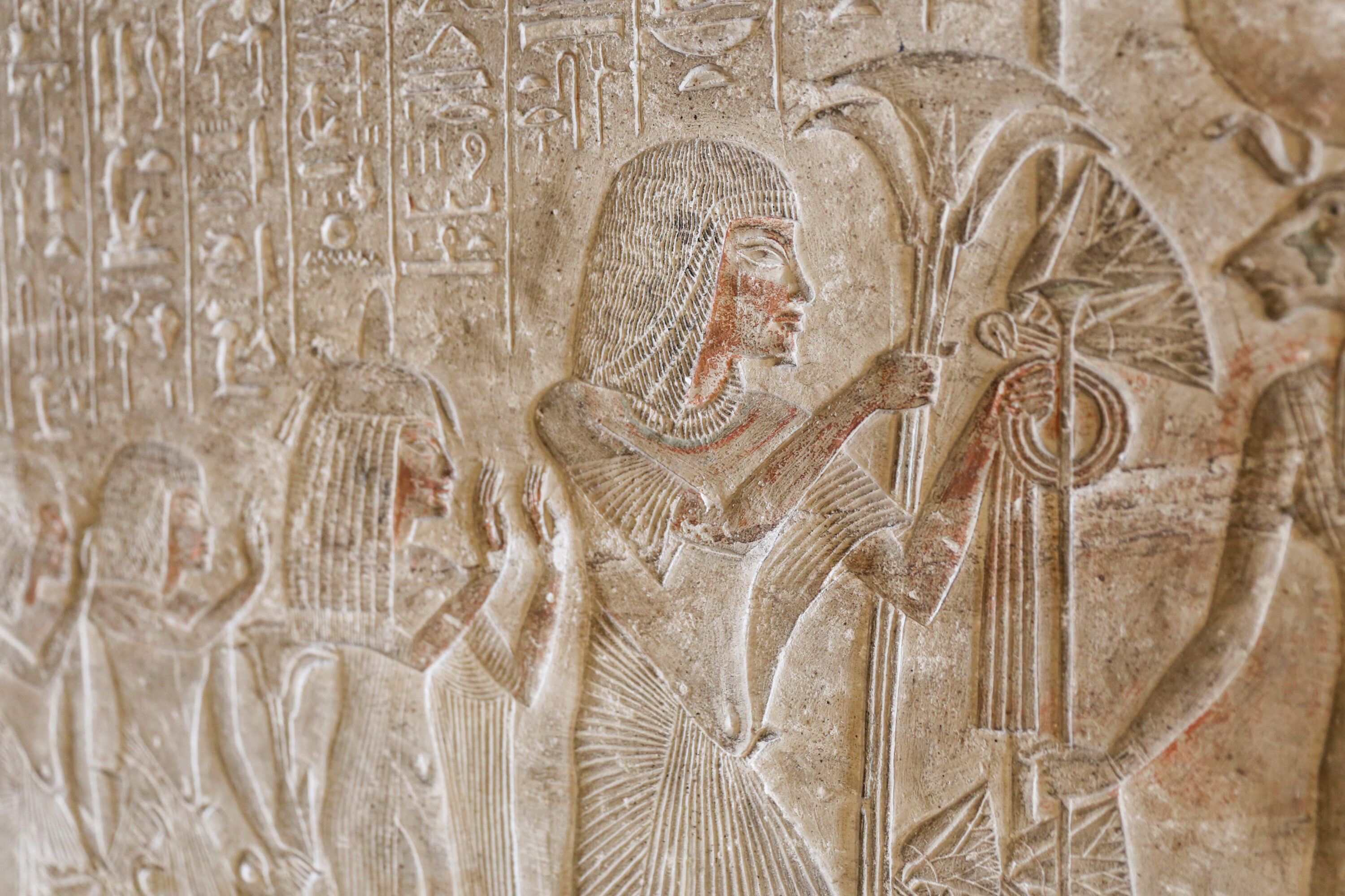 Akhenaten presenting lotus bouquets to the hand-ended rays of the Aten on Amarna stela SR 13394