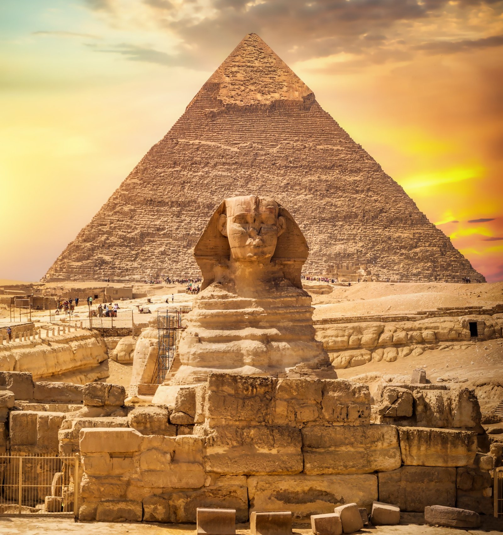 Great sphinx and pyramid under bright sun