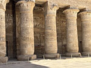 Papyriform columns in the Mortuary Temple of Ramesses III at Medinet Habu covered with royal cartouches, offering scenes and hieroglyphic inscriptions