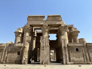 Sandstone columns and carved entrance facade of the Temple of Kom Ombo beside the Nile River in Egypt