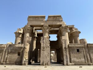 Sandstone columns and carved entrance facade of the Temple of Kom Ombo beside the Nile River in Egypt