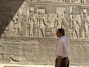 Wall of carved Egyptian deities and hieroglyphs at the Temple of Kom Ombo in Upper Egypt