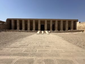 Long columned sandstone facade of the Temple of Seti I at Abydos in Egypt