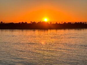 Warm sunrise light over the Nile River in Egypt