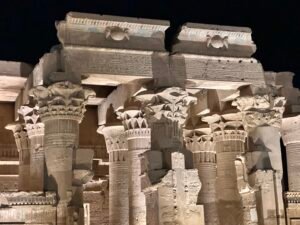 Illuminated floral-capital columns and carved lintels of the Graeco-Roman Temple of Kom Ombo, dedicated to Sobek and Haroeris, north of Aswan, Egypt