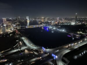 Night view of Cairo’s illuminated skyline, Nile River, bridges, and Cairo Tower