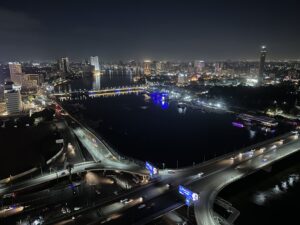 Night view of Cairo’s illuminated skyline, Nile River, bridges, and Cairo Tower