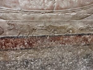 Old Kingdom relief in the Mastaba of Princess Idut at Saqqara showing a female hippopotamus giving birth as a crocodile opens its jaws toward the newborn calf