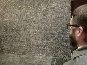 Close view of the dense horizontal hieroglyphic text on the Merneptah Stele, also called the Israel Stele, JE 31408, in the Egyptian Museum in Cairo