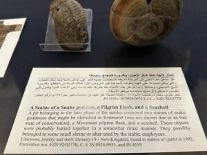 Egyptian Museum in Cairo label for a Dynasty 19 Qantir deposit with a possible Renenutet statue, Mycenaean pilgrim flask, and seashell