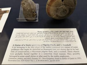 Egyptian Museum in Cairo label for a Dynasty 19 Qantir deposit with a possible Renenutet statue, Mycenaean pilgrim flask, and seashell