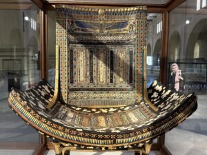 Ceremonial throne of Tutankhamun, JE 62030, with spotted animal-skin inlay and winged Nekhbet on the backrest, photographed in the Egyptian Museum in Cairo