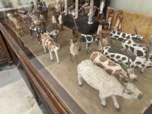 Close view of Meketre’s cattle census model, JE 46724, showing painted cattle and herders before the columned inspection pavilion, Egyptian Museum Cairo