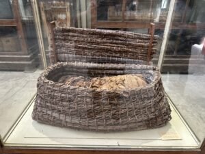 Reed basket coffin from Tarkhan Grave 1004 with a linen-wrapped body in contracted position, probably 3rd Dynasty, Egyptian Museum Cairo