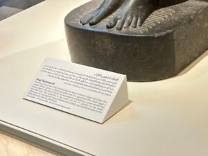 National Museum of Egyptian Civilization label for the 18th Dynasty black granite statue of King Thutmose III from Karnak