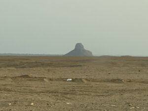 Distant view of the eroded mudbrick Black Pyramid of 12th-Dynasty Pharaoh Amenemhat III rising from the Dahshur desert in Egypt