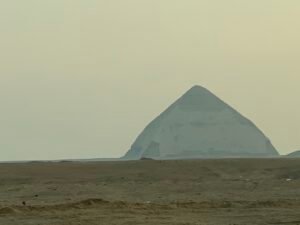 Bent Pyramid of Sneferu viewed from a distance across the flat desert at Dahshur