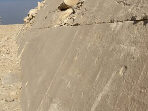 Close view of surviving smooth Tura limestone casing blocks on the lower face of Pharaoh Sneferu’s Bent Pyramid at Dahshur, Egypt