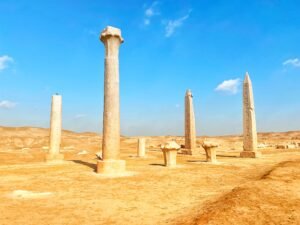 Standing ancient Egyptian obelisks and columns at Tanis in the eastern Nile Delta