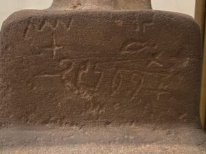 Close-up of the worn hieroglyphic inscription naming Hetep and recording titles and offering text on his 12th-Dynasty granite block statue, JE 48858, Egyptian Museum in Cairo