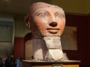 Painted limestone head of Pharaoh Hatshepsut from an Osiride statue at her mortuary temple at Deir el-Bahari, displayed in the Egyptian Museum in Cairo