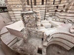 Excavated Roman fortress walls, arches, and foundations beside the Coptic Museum in Coptic Cairo