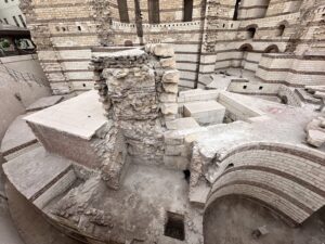 Excavated Roman fortress walls, arches, and foundations beside the Coptic Museum in Coptic Cairo