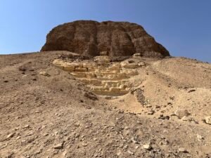 Eroded mudbrick core of the Pyramid of Senusret II rising above the desert at Lahun, Egypt