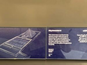 Grand Egyptian Museum label for the Dynasty 12 limestone seated statue of King Amenemhat III from his mortuary temple at Hawara