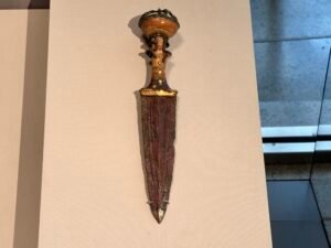 Small ceremonial dagger of Queen Ahhotep, JE 4668 and CG 52660, with gilded bronze blade and discoid pommel, from Dra Abu el-Naga and displayed at the Grand Egyptian Museum