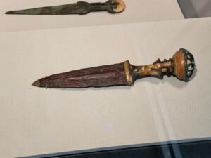 Queen Ahhotep’s discoid-pommel dagger, JE 4668 and CG 52660, displayed with a second ancient royal dagger at the Grand Egyptian Museum in Giza