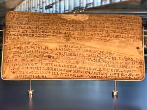 Carnarvon Tablet I, JE 41790 / GEM 22841, a wooden writing board covered with hieratic text recounting King Kamose's war against the Hyksos, photographed at the Grand Egyptian Museum in Giza