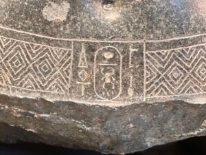 Royal cartouche carved on the granite statue of Amenhotep II, GEM 3796 from Karnak, at the Grand Egyptian Museum in Giza