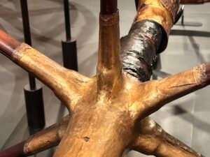 Close view of the gilded six-spoke wheel hub on Tutankhamun’s ceremonial chariot, JE 61990A and Carter 122, from tomb KV62 at the Grand Egyptian Museum