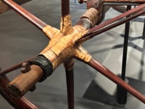 Six joined wooden spokes, gilded hub and axle assembly of Tutankhamun’s ceremonial chariot, JE 61990A and Carter 122, from tomb KV62 at the Grand Egyptian Museum