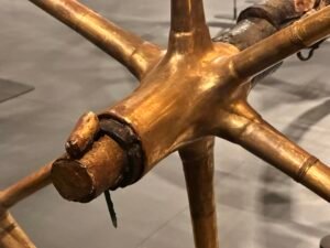 Gilded six-spoke wheel hub and axle pin of Tutankhamun’s ceremonial chariot, JE 61990A and Carter 122, from KV62 at the Grand Egyptian Museum