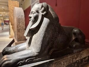 Grey granite sphinx of Pharaoh Amenemhat III, JE 15210 / CG 394, with lion mane, royal beard and later hieroglyphic inscriptions, Egyptian Museum in Cairo