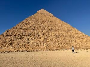Pyramid of Khafre rising above the Giza Plateau with its surviving smooth limestone casing visible near the summit