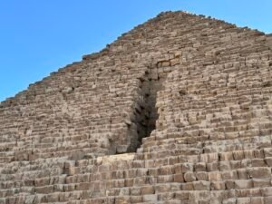 Large vertical breach cut into the north face of the Pyramid of Menkaure on the Giza Plateau