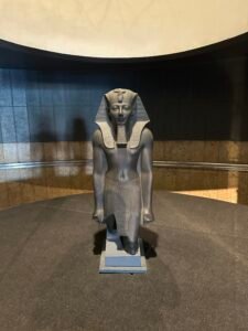 Greywacke kneeling statue of Pharaoh Thutmose III, CG 42054 / JE 36927, wearing the nemes headdress and royal beard at Luxor Museum