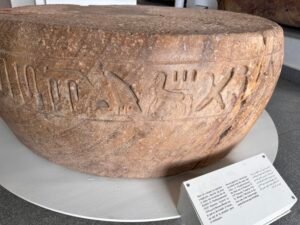 Reused quartzite column base inscribed with the name and titles of Prince Pareherwenemef, son of Ramesses II, found at the Temple of Amun at Tanis in Egypt's eastern Nile Delta