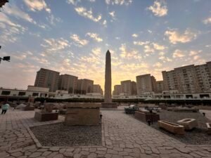 Obelisk of Pharaoh Senusret I silhouetted at sunset in the Matariya Open-Air Museum at ancient Heliopolis in Cairo