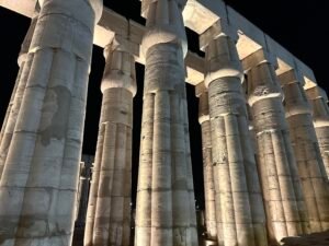 Close nighttime view of papyrus-bundle columns in Pharaoh Amenhotep III's peristyle court at Luxor Temple in Luxor, Egypt