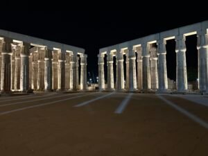 Wide nighttime view of the double papyrus-bundle colonnades in Pharaoh Amenhotep III's peristyle court at Luxor Temple in Luxor, Egypt