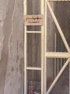 Entrance gate and KV6 sign for the Tomb of Pharaoh Ramesses IX in the Valley of the Kings on Luxor's west bank