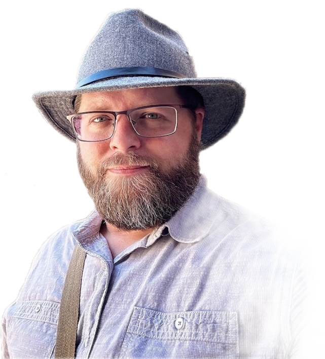 Cutout portrait of Nate Loper wearing glasses, a gray wide-brim hat and light shirt against a transparent background for Egypt Christian Tours