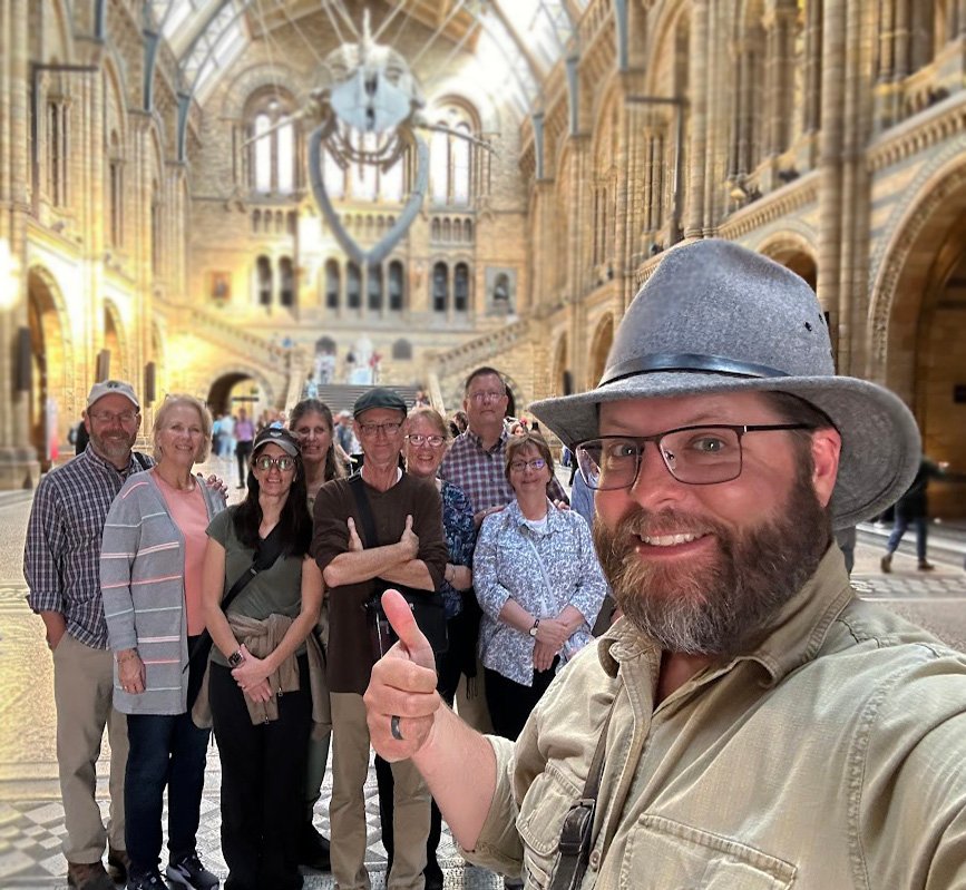 Nate Loper with tour group at the Natural History Museum in London